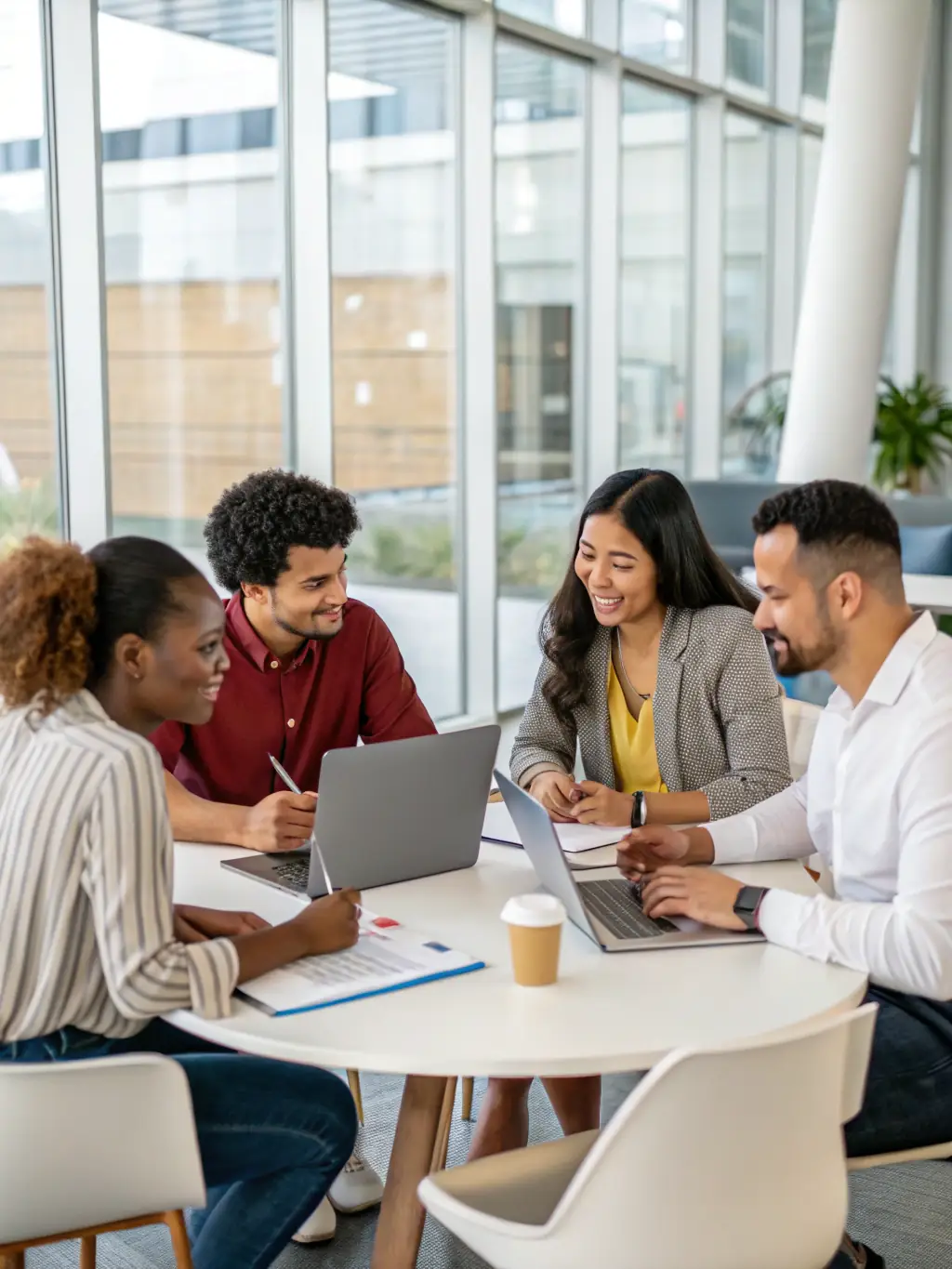 A diverse group of business owners collaborating on a digital strategy, showcasing the collaborative nature of Human Vernacular's services.